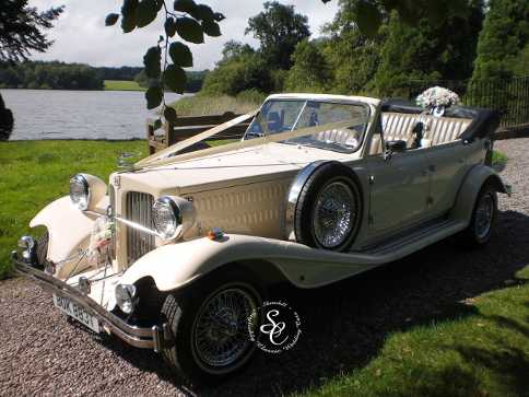 Beauford wedding car at the lakeside in the grounds of Chillington Hall.