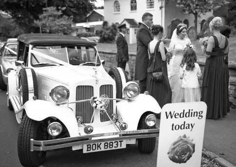 Bride standing near to the Beauford after her arrival at Wombourne.