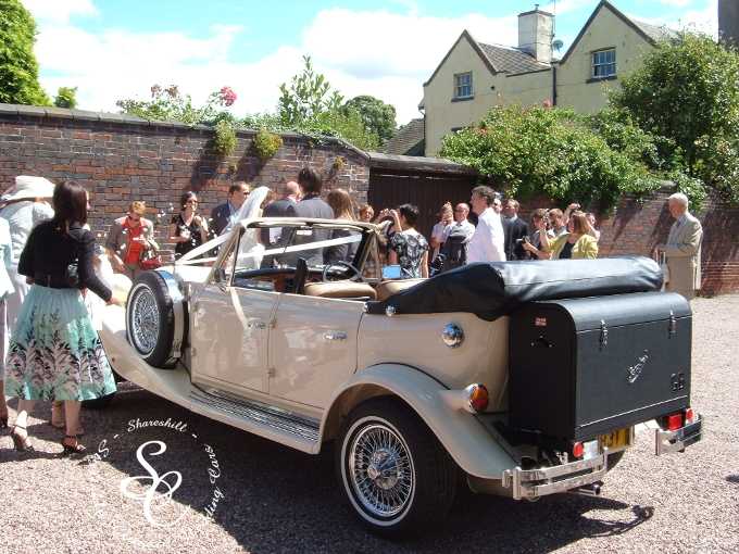 Wedding group and Beauford wedding car at Shareshill Church.